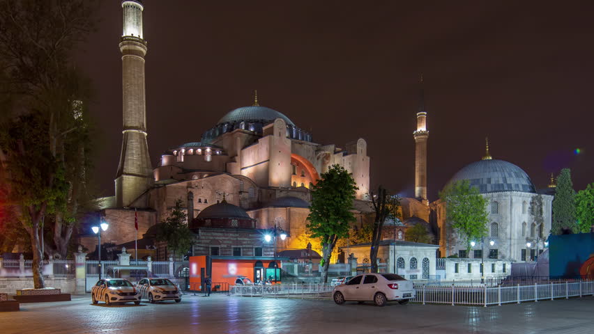 Illuminated Hagia Sophia timelapse - ancient orthodox temple in Istanbul on illuminated at twilight. Aya-Sofia famous landmark of byzantine architecture in Medieval Constantinople. Cathedral of Holy