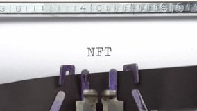 NFT word closeup being typing and centered on a sheet of paper on old vintage typewriter mechanical - Powered by Shutterstock - Get 15% off with code: PIKWIZARD15