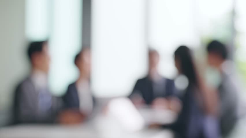 Group of businessperson meeting in the office. Blurred image. Royalty-Free Stock Footage #1099291017