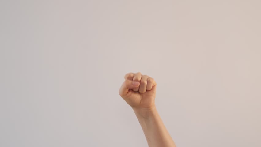 Woman hand counting from 0 to 5 on a gray background. female shows fist fist, then one, two, three, four, five fingers. Math concept.