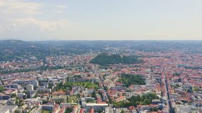 Inscription on video. Graz, Austria. The historic city center aerial view. Mount Schlossberg (Castle Hill). Heat burns text, Aerial View, Point of interest