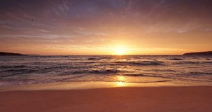 Color sunrise over tropical island beach shore. Exotic Ocean Sunset, 4K video relax and travel concept