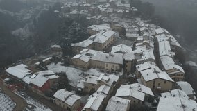 Castell'Arquato, Piacenza, Italy , aerial drone footage while snowing in town