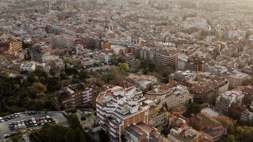 Drone shot of mountains between buildings | Shutterstock HD Video #1099299321