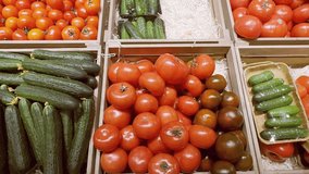 buying vegetables in the supermarket (tomatoes and cucumbers)