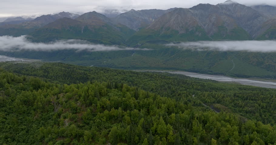 Aerial Panning Tranquil View Of Green Mountains In National Park Under Cloudy Sky - Denali, Alaska