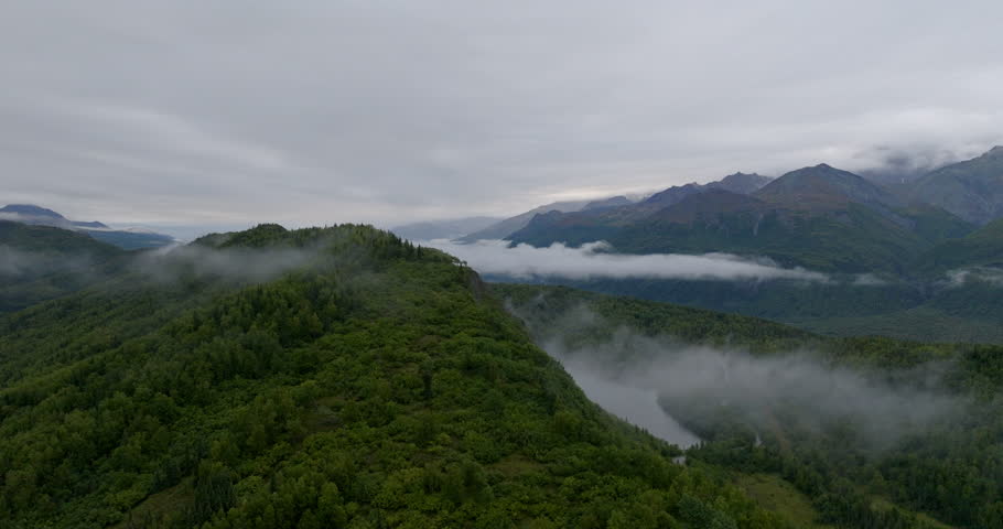Aerial Panning Shot Of River In Beautiful Denali National Park Under Cloudy Sky