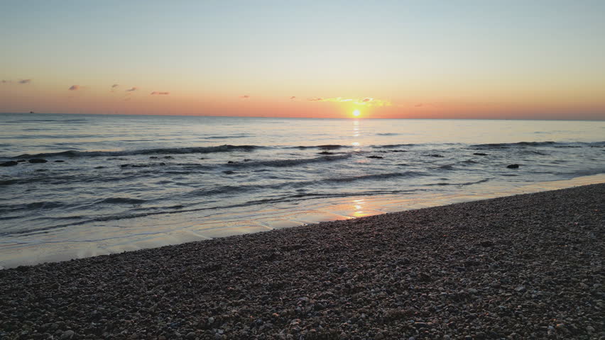 A drone view over a beach and ocean.
