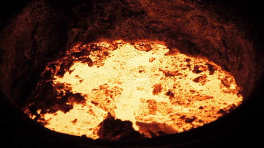 Melted metal on a furnace  | Shutterstock HD Video #1099315327