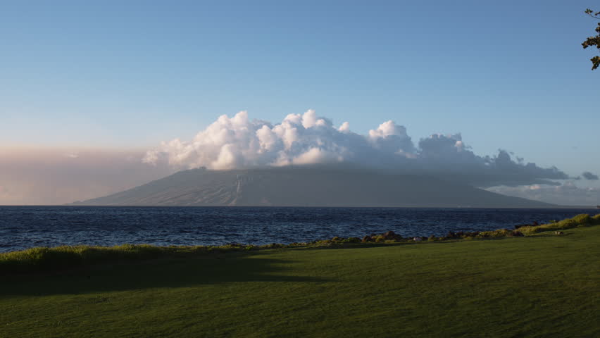 Perfect view of a cloud covered volcano in Hawaii on a clear day