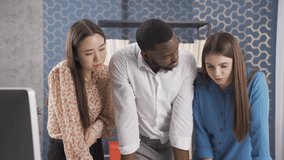 Multiethnic young asian woman black man and european woman working in office and discussing on computer and project.
Colleagues from different races, who enjoy working as a team, are happy and enjoy t - Powered by Shutterstock - Get 15% off with code: PIKWIZARD15