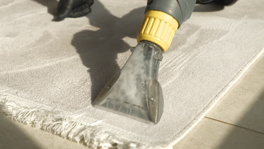 CLOSE UP: Fresh and clean woven floor carpet after thorough spring deep cleaning. Revealing clean fabric at washing and vacuuming of rug with electric household accessories during spring-cleaning. | Shutterstock HD Video #1099323157