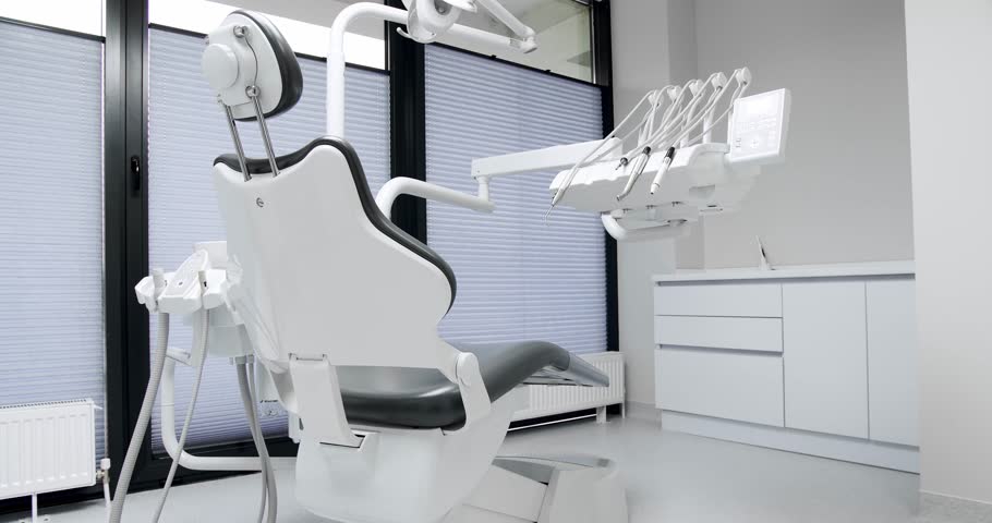 Modern Room with dental chair and medical equipment. Modern Dental office. Dental equipment at dental office.  | Shutterstock HD Video #1099325945