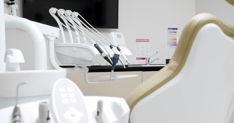 Modern Room with dental chair and medical equipment. Concept of dental care. Modern dental practice. Dental clinic equipment. | Shutterstock HD Video #1099325957