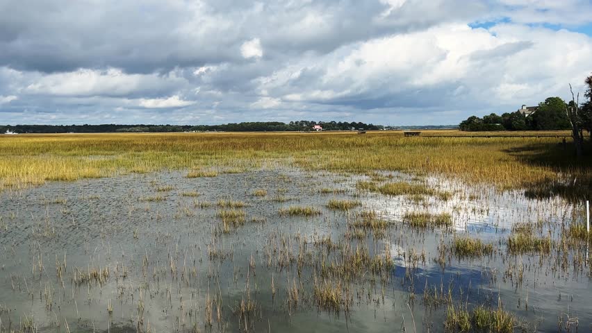 Beautiful view of an island salt marsh with partly cloudy skies