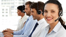 Animation of snowfall over diverse customer service representatives working on computer in office. Digital composite, multiple exposure, call center, teamwork, winter and technology concept. - Powered by Shutterstock - Get 15% off with code: PIKWIZARD15