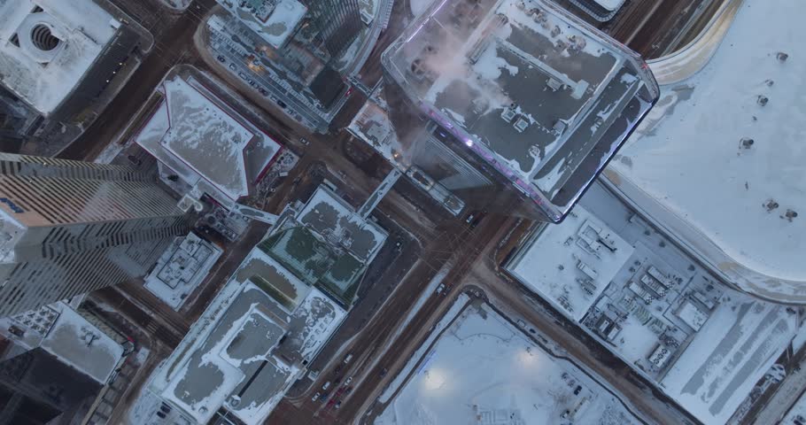 Aerial footage of the high skyscrapers buried in snow at sunrise in Edmonton Alberta