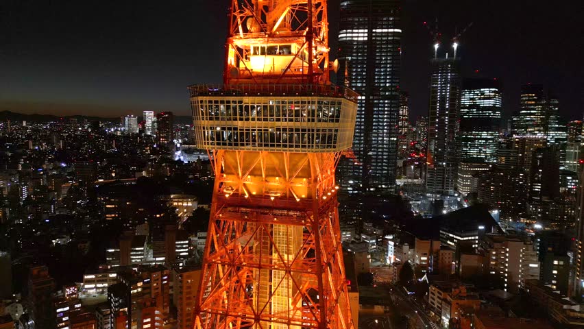 Flying close to the Tokyo Tower observation point in the late winter evening Royalty-Free Stock Footage #1099333981