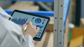 Worker checking inventory on a tablet warehouse management system. - Powered by Shutterstock - Get 15% off with code: PIKWIZARD15