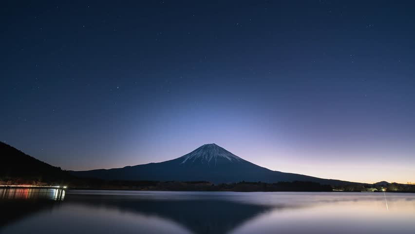 Mt. Fuji above lake Tanuki with starry night time lapse, Dec.31 2022 Royalty-Free Stock Footage #1099334143
