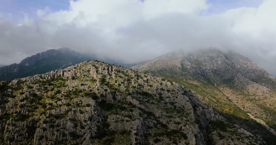 Beautiful rocky mountain landscape in summer, cloudy sky. Spain
