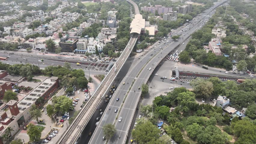 An Aerial Shot of Delhi Metro and Traffic movement at Moolchand Flyover in New Delhi,India
