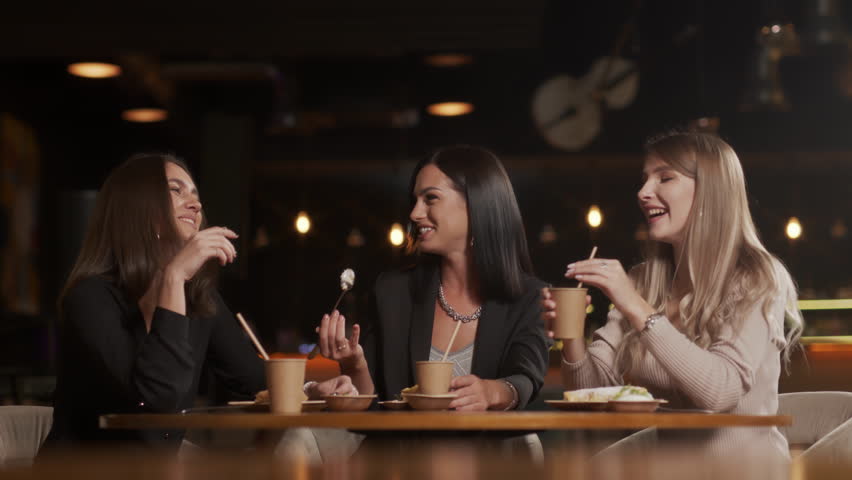 Happy group of friends hanging out in cafe chatting sharing conversation drinking coffee enjoying socializing having fun meet up in restaurant | Shutterstock HD Video #1099343799