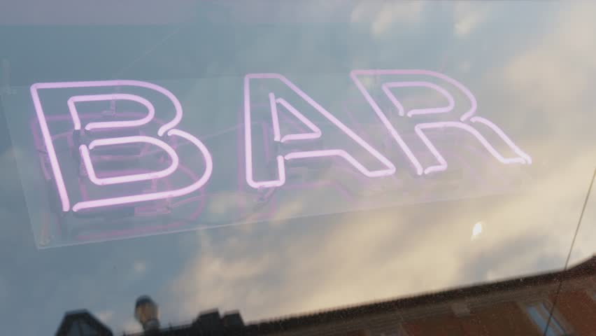 A closeup of a pink BAR neon light sign behind a window in Oslo, Norway | Shutterstock HD Video #1099354205