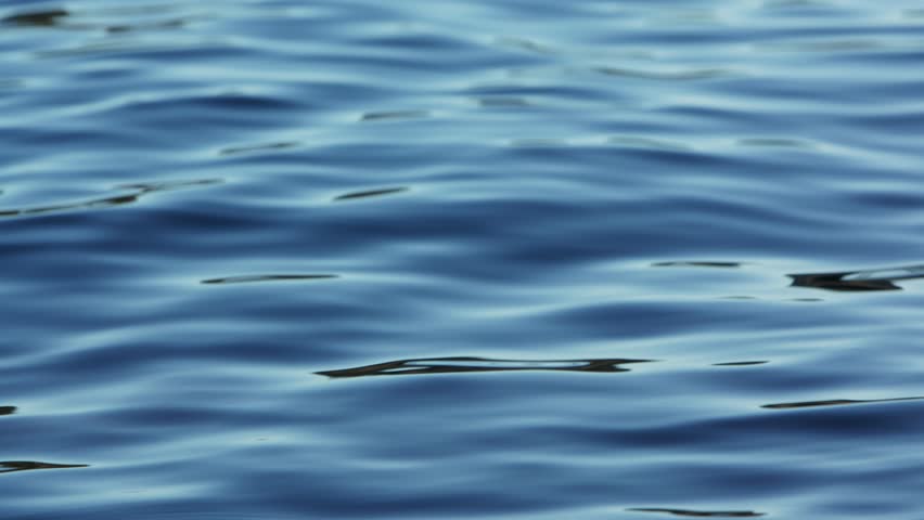 A closeup footage of a blue waving water