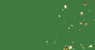 Animation of stars and snow over christmas decorations on green background with copy space. Christmas, tradition and celebration concept digitally generated video.