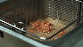 Close up footage of Chef preparing frying chicken