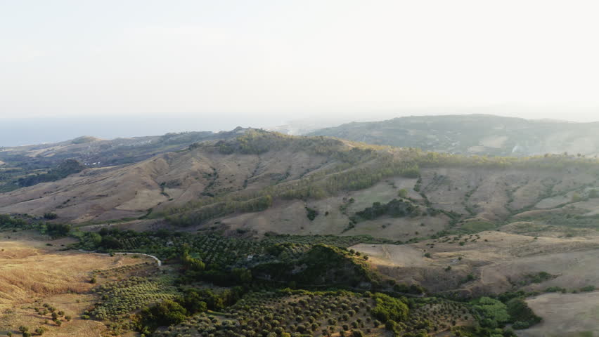 Landscape in the late summer afternoon with yellow hill in nature