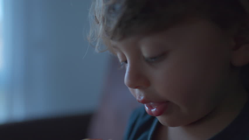 Little boy snacking apple fruit. Child taking a bite of healthy food | Shutterstock HD Video #1099372621