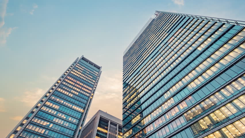 Twilight sky time lapse view looking up at modern office building. Business, corporate  and finance concept. | Shutterstock HD Video #1099380401