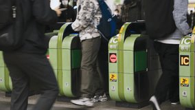 (Shot on RED Komodo) Japanese people, crowd Asian travelers walk pass automatic ticket turnstile gate at Japan subway station entrance. Asia transport, Tokyo city life, train transportation commuter - Powered by Shutterstock - Get 15% off with code: PIKWIZARD15