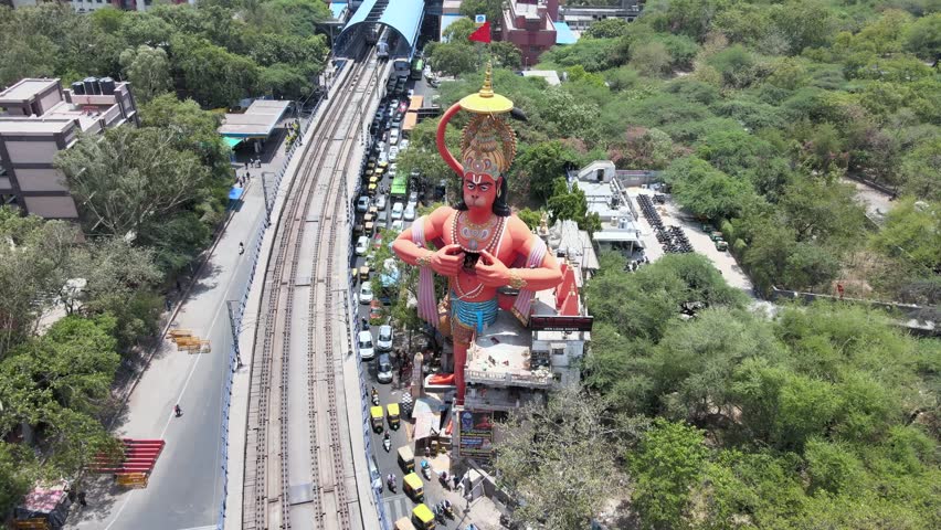 An Aerial Shot of Hanuman statue and Delhi Metro at Jhandewalah, New Delhi,India
