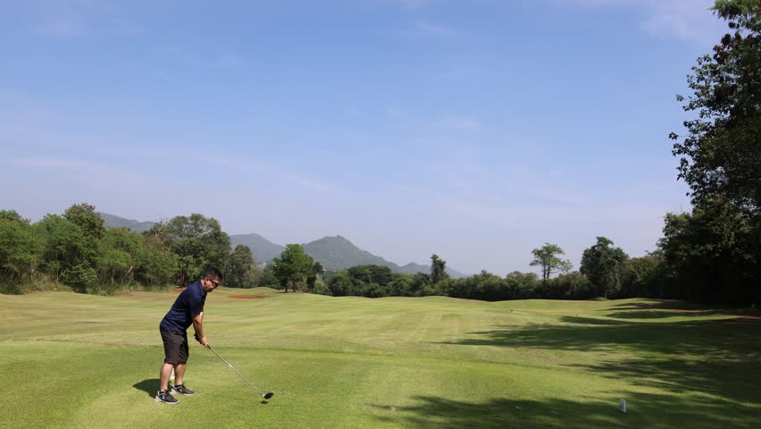 Golf swing drive shot, Man playing golf on golf course, Scene of nature landscape. Royalty-Free Stock Footage #1099388871