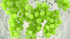 Super Slow Motion Shot of Fresh Green Grape Wine Falling into Water on White Background at 1000 fps. - Powered by Shutterstock - Get 15% off with code: PIKWIZARD15
