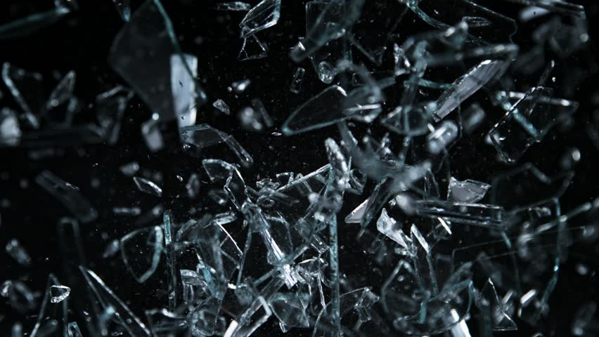 Super Slow Motion Shot of Glass Shards Flying Towards Camera Isolated on Black at 1000fps. | Shutterstock HD Video #1099389077