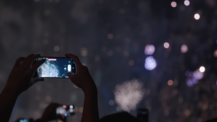 Silhouette Crowd of People Hands Recording Beautiful Fireworks Using Their Mobile Phones in Slow Motion Royalty-Free Stock Footage #1099398579