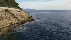 Coastal line of Saint jean Cap Ferrat, aerial 4 k video drone, blue sky, blue Mediterranean sea, rocky coastal line, sea waves, green and blue color sea