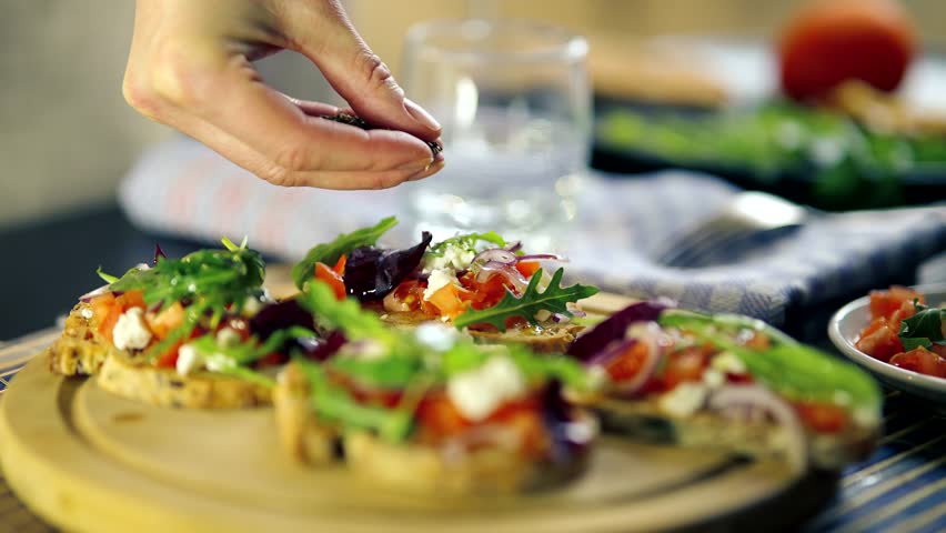 Tasty Bruschetta With Seasoning Antipasti. Delicious Tapas Oregano Seasoning . Italian Restaurant  Traditional Food. Appetizer Bruschetta Antipasto. Mediterranean Food Spanish Tapas Starter Bruschetta | Shutterstock HD Video #1099401669