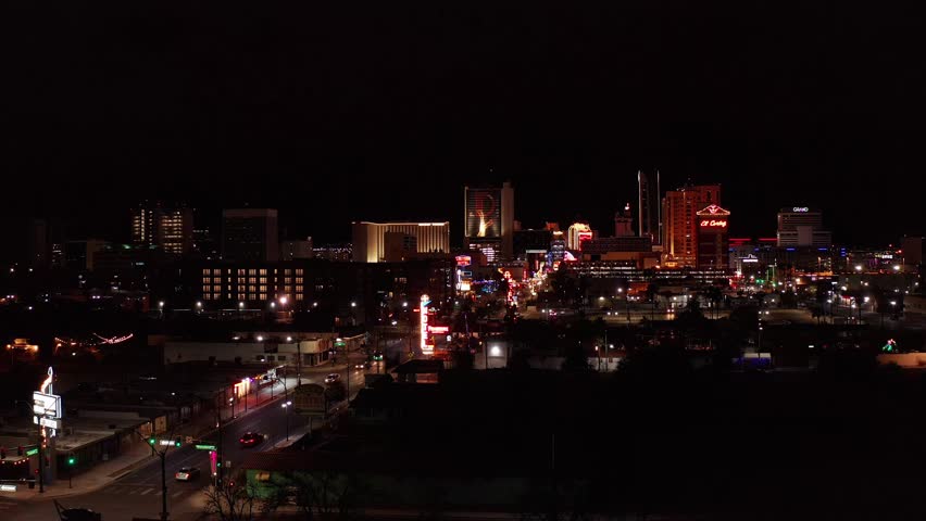 Low wide aerial shot of Fremont Street in downtown Las Vegas at night. 4K