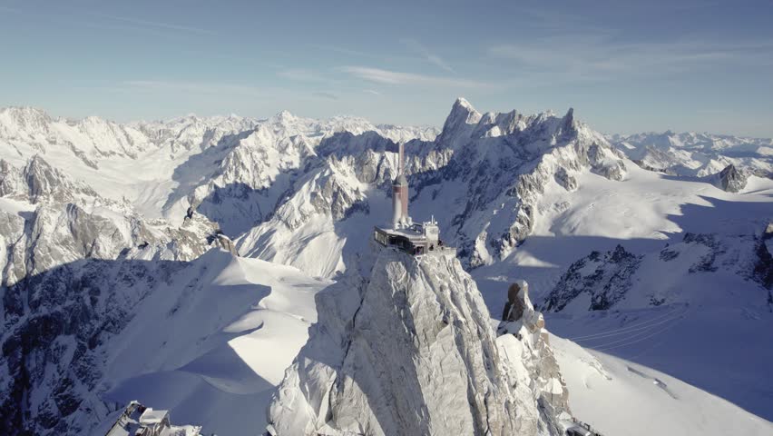 Visitor center Aiguille du Midi and observation deck near the Mont Blanc Mountain peak, Aerial flyover approach shot