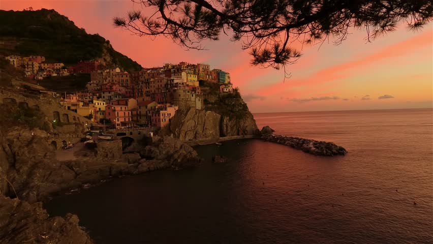 Small touristic town on the coast, Manarola, Italy. Cinque Terre. Colorful Sunny Sunset Fall Season. Slow Motion Cinematic Royalty-Free Stock Footage #1099407069