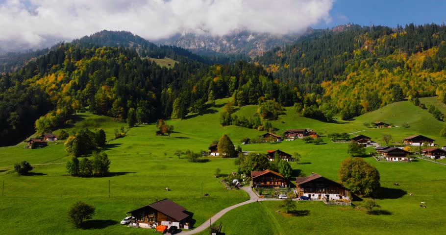 Aerial view of the beautiful Swiss nature and village in Switzerland Royalty-Free Stock Footage #1099411189
