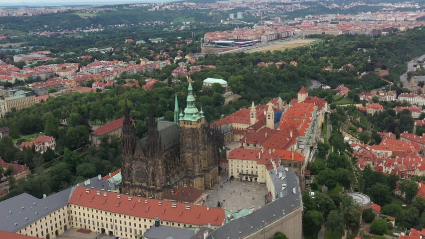 Prague Old Town with St. Vitus Cathedral and Prague castle complex with buildings revealing architecture from Roman style to Gothic 20th century. Prague, capital city of the Czech Republic. Drone, 4k.