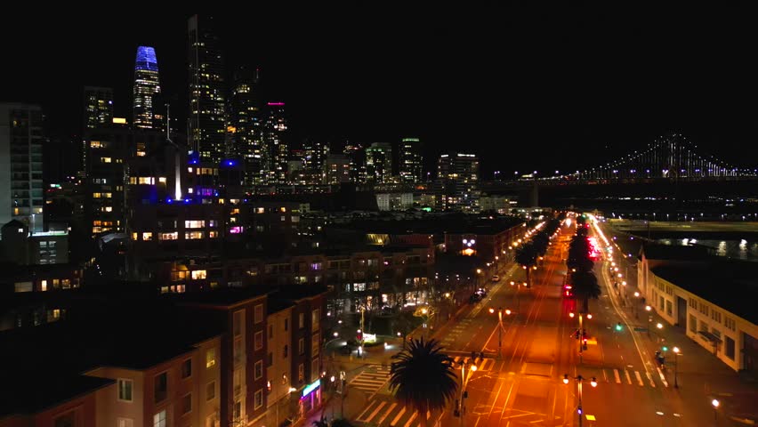 Above San Francisco . Oakland Bay bridge at night. Aerial cinematic shot
