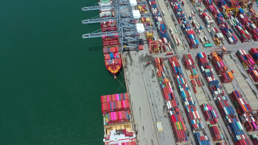 Aerial top view of Container ship loading and unloading, Cargo container in deep seaport for the international order concept. 4K | Shutterstock HD Video #1099422103