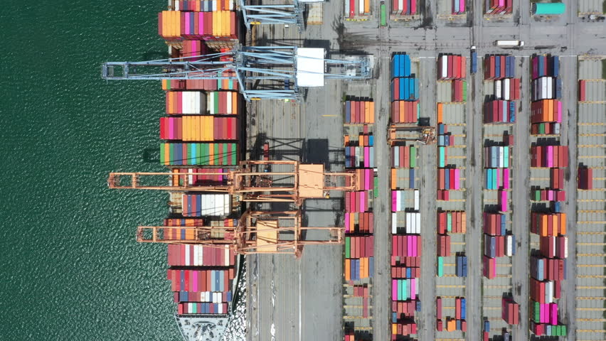 Aerial top view of Container ship loading and unloading, Cargo container in deep seaport for the international order concept. 4K Footage. | Shutterstock HD Video #1099422109